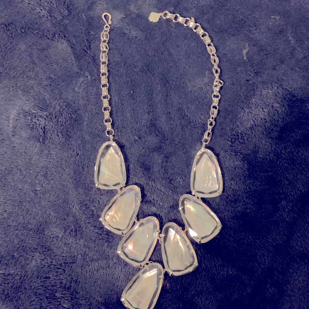 Silver Kendra Scott necklace.